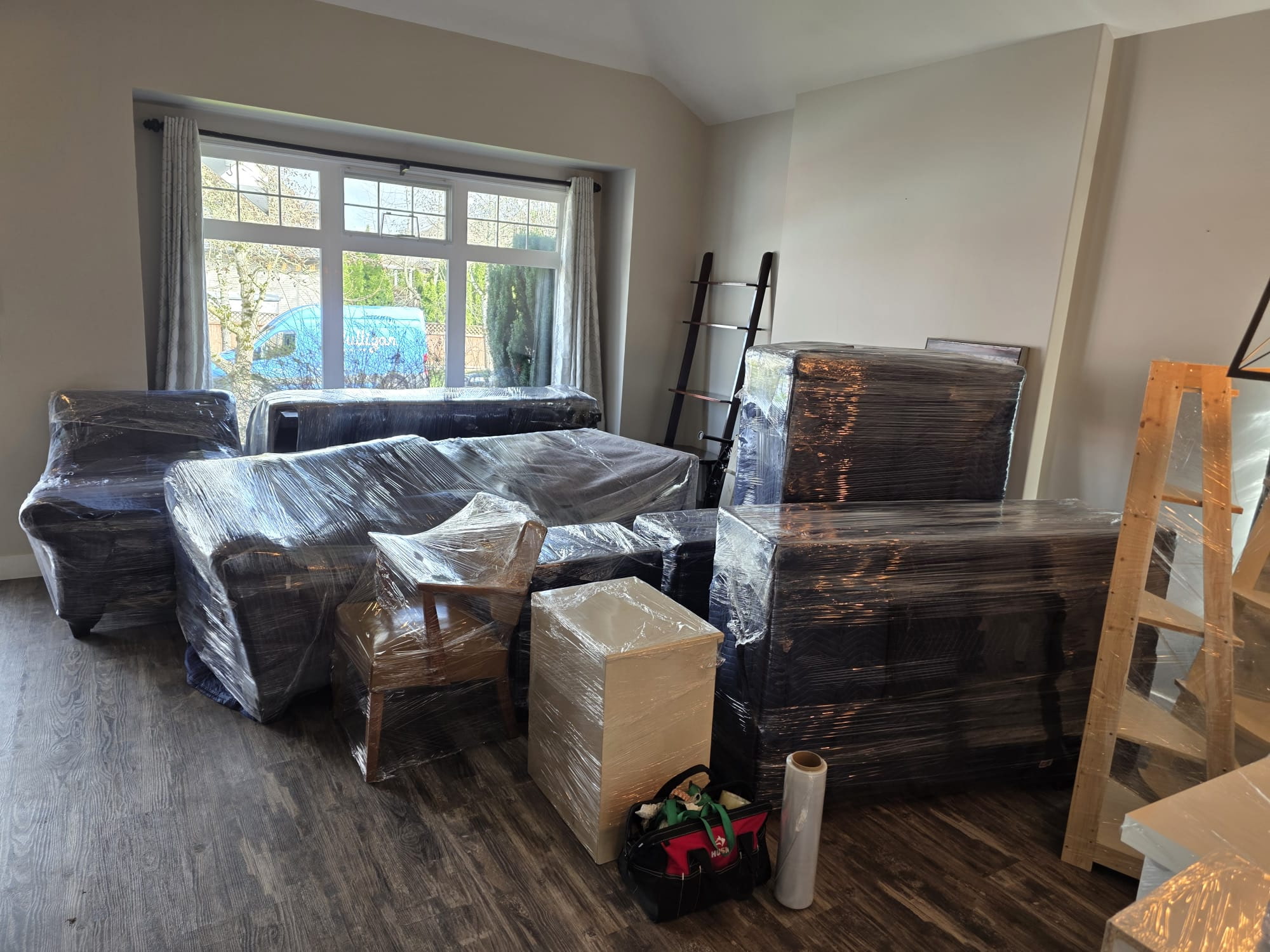 Wrapped furniture ready for a Surrey move