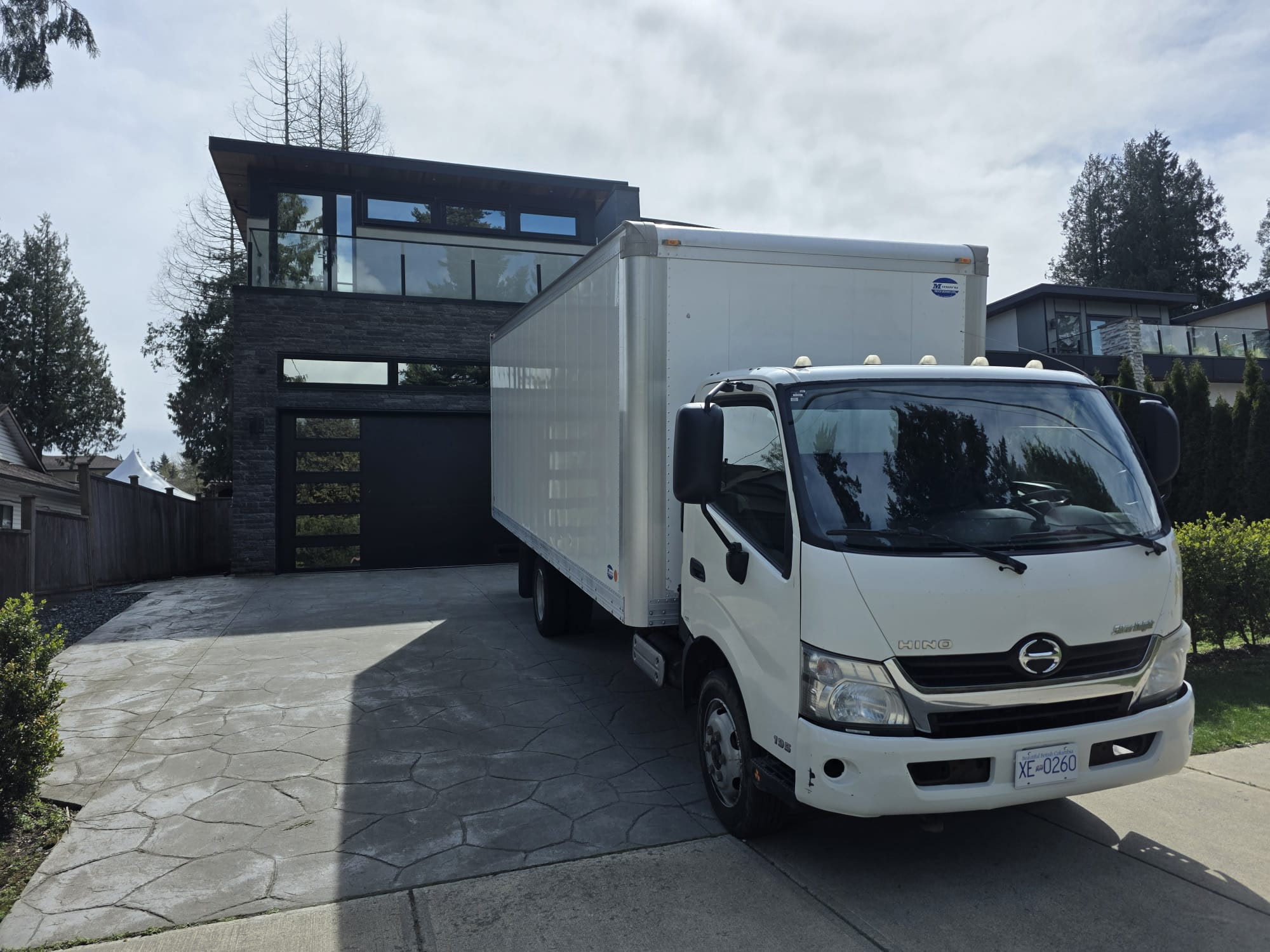 North Haul moving truck parked at a client's home, ready on moving day